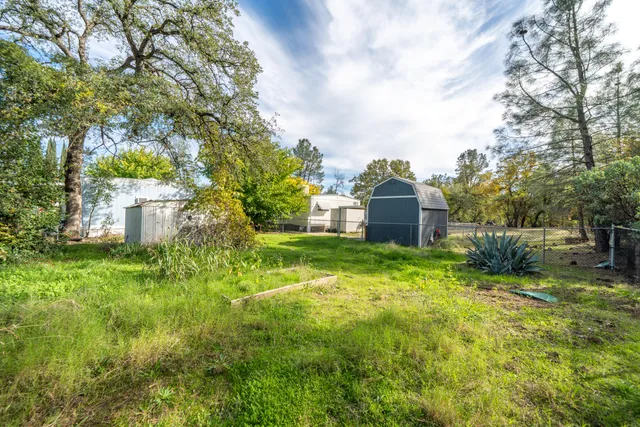 a backyard of a house with lots of green space