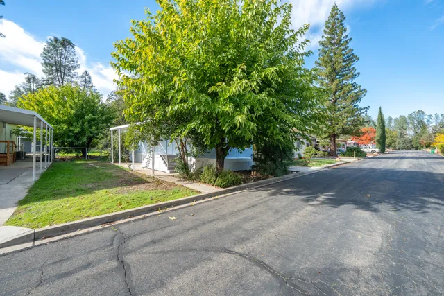 a view of a street with a building in the background