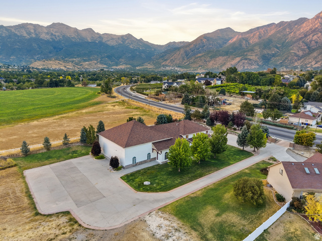 702 Alpine Highway Alpine, UT 84004 - Photo 11 of 83 Expansive property featuring a large concrete driveway and surrounding green lawn