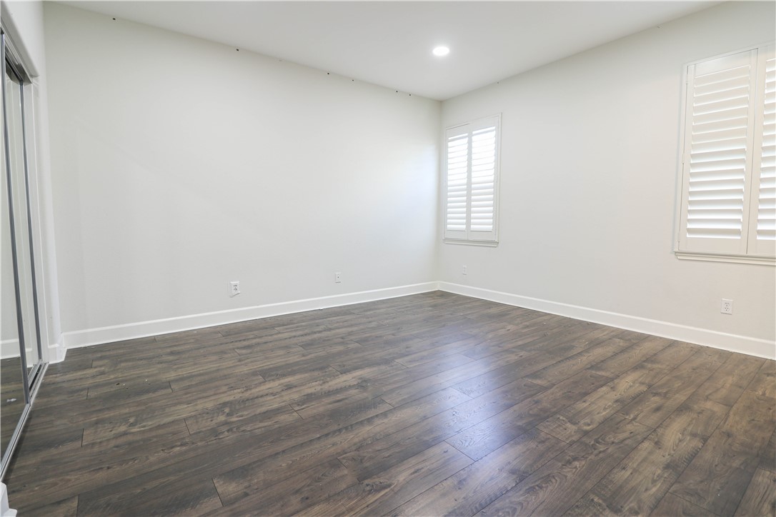 2850 North Stone Pine Glen Santa Ana, CA 92706 - Photo 18 of 45 wooden floor in an empty room with a window