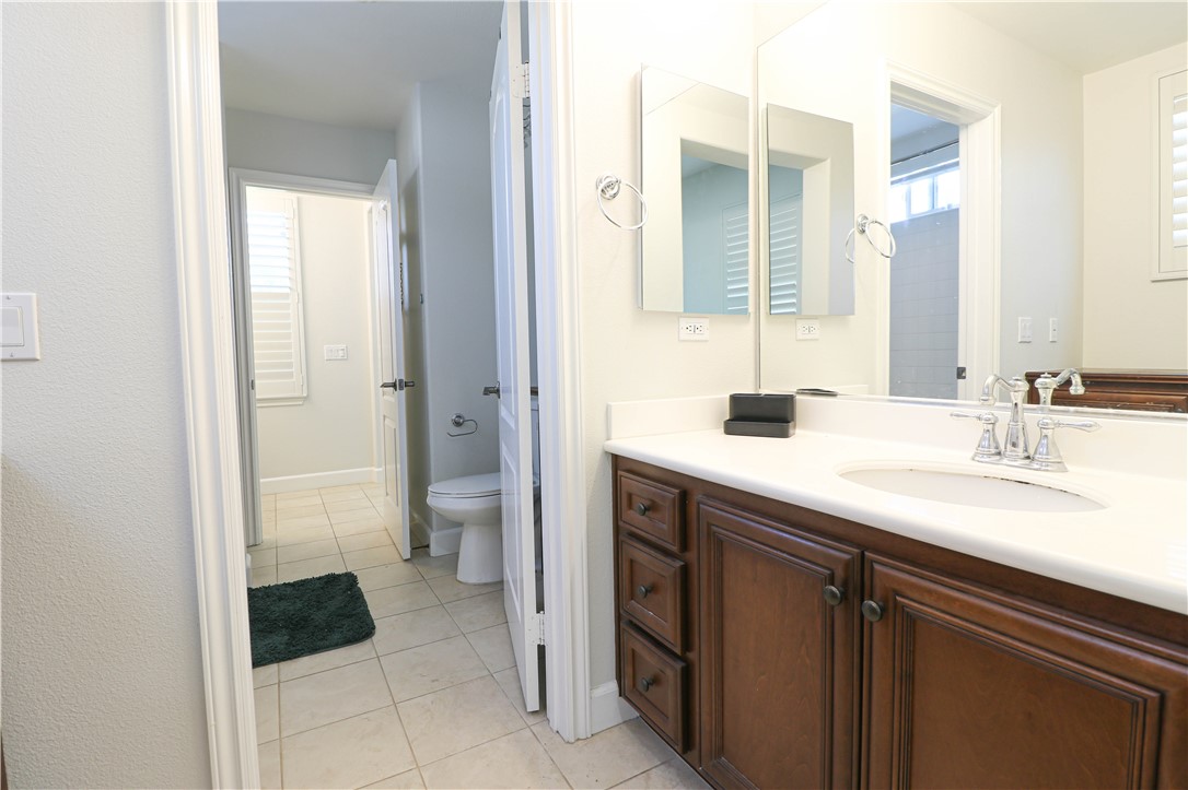 2850 North Stone Pine Glen Santa Ana, CA 92706 - Photo 20 of 45 a bathroom with a sink and a mirror