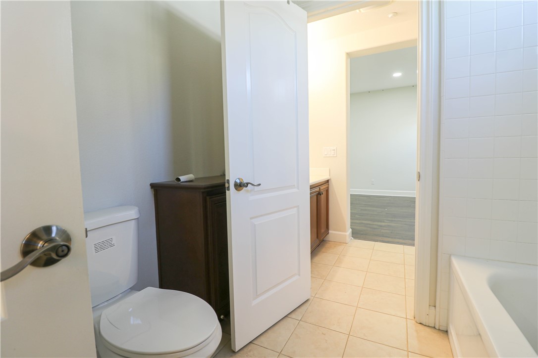 2850 North Stone Pine Glen Santa Ana, CA 92706 - Photo 21 of 45 a white toilet sitting next to a bathroom sink
