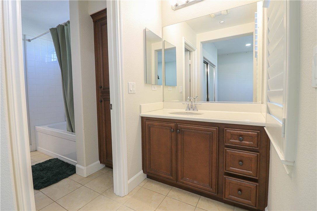 2850 North Stone Pine Glen Santa Ana, CA 92706 - Photo 22 of 45 a bathroom with a sink and a mirror