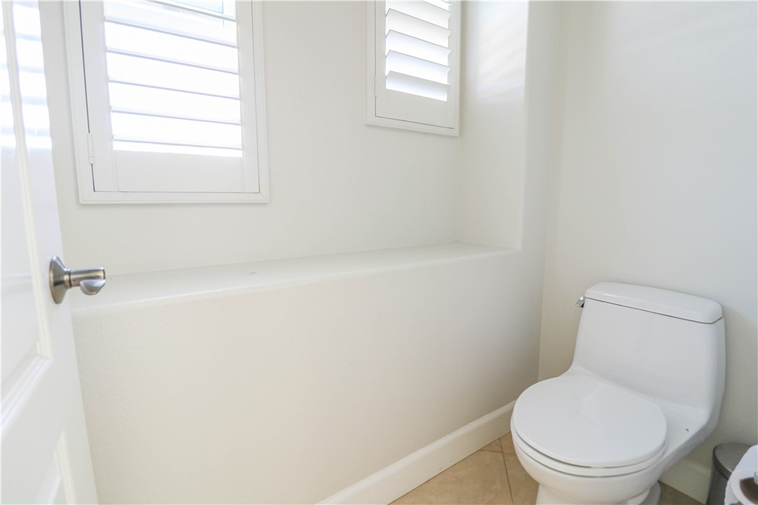 2850 North Stone Pine Glen Santa Ana, CA 92706 - Photo 28 of 45 a white toilet sitting next to a window