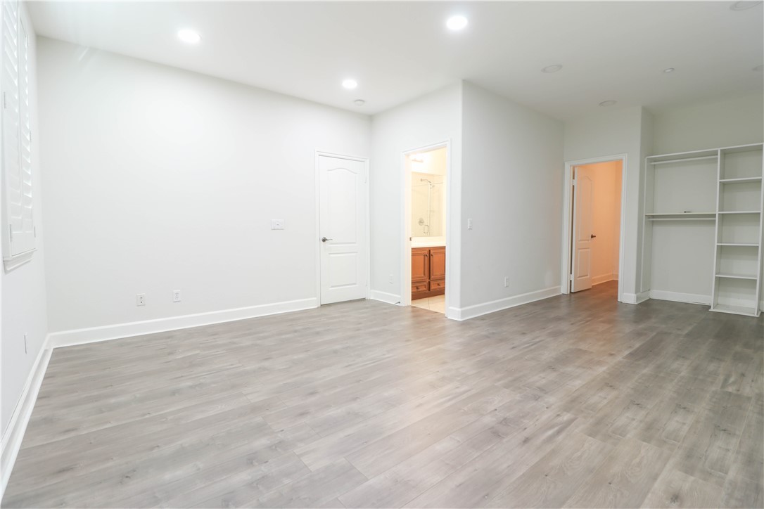 2850 North Stone Pine Glen Santa Ana, CA 92706 - Photo 37 of 45 an empty room with closet and wooden floor