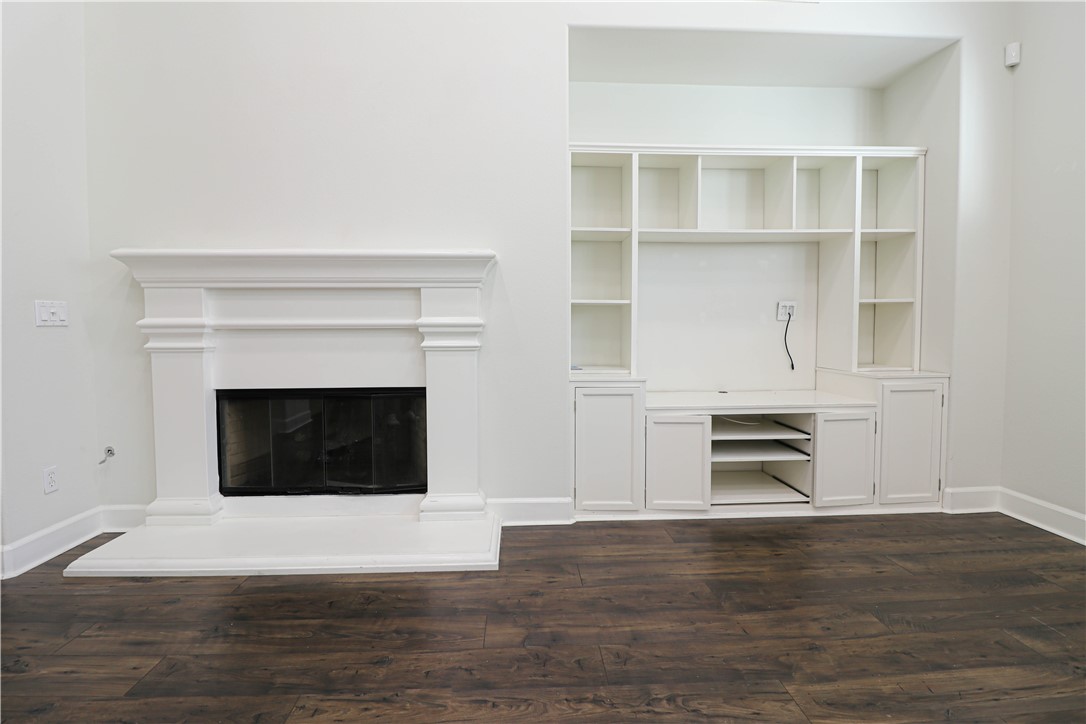 2850 North Stone Pine Glen Santa Ana, CA 92706 - Photo 41 of 45 a view of an empty room with a fireplace and a window
