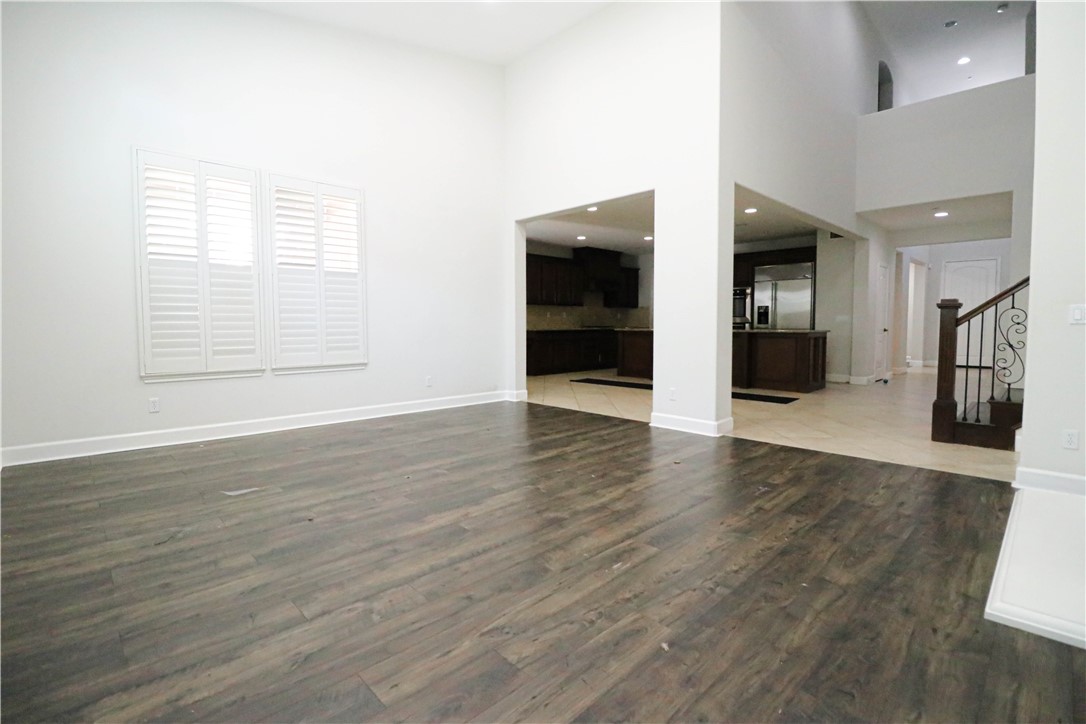 2850 North Stone Pine Glen Santa Ana, CA 92706 - Photo 42 of 45 an empty room with wooden floor and windows