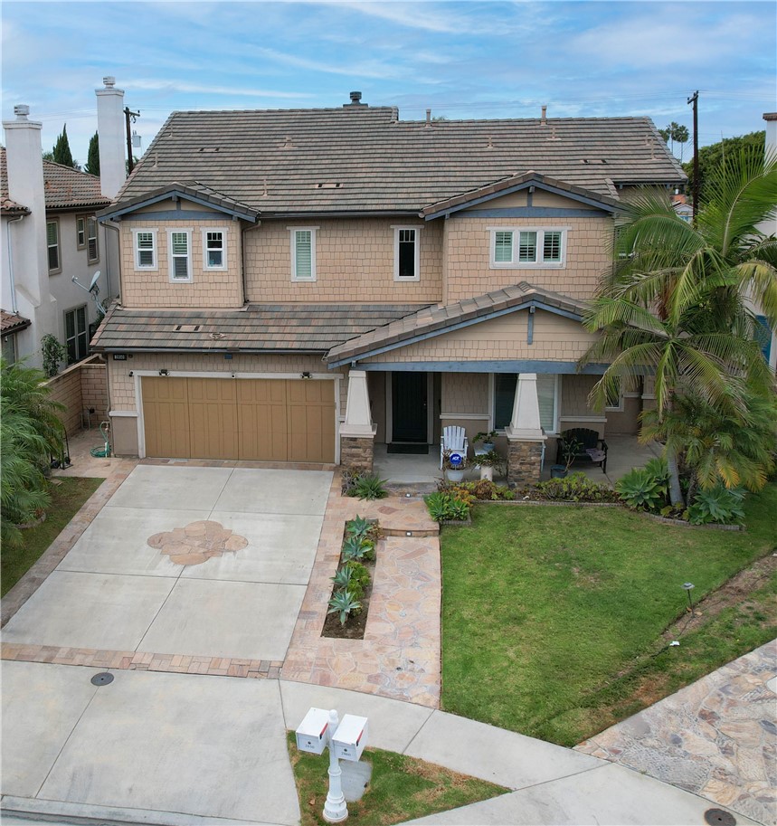2850 North Stone Pine Glen Santa Ana, CA 92706 - Photo 10 of 45 a front view of a house with a yard