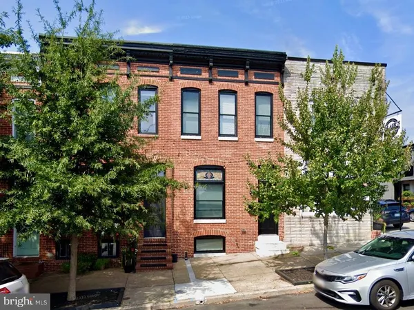 a front view of a house with parking