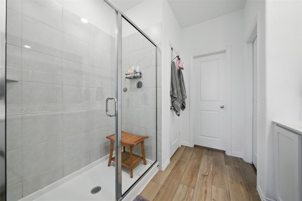 14808 Hester Trail Fort Worth, TX 76052 - Photo 20 of 31 a bathroom with a bathtub and a shower