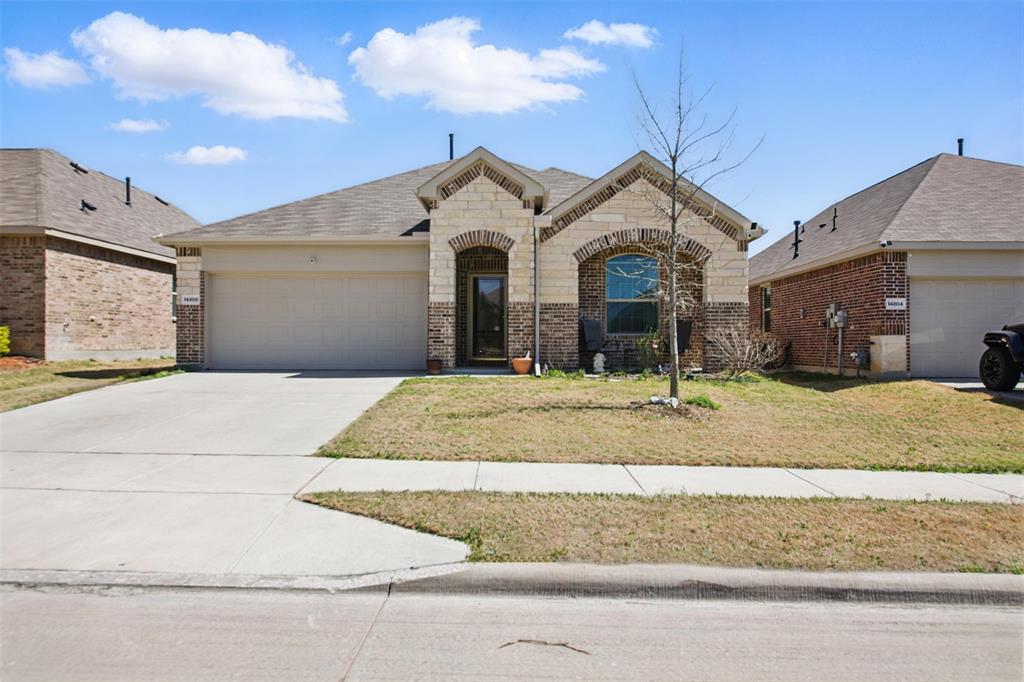 14808 Hester Trail Fort Worth, TX 76052 - Photo 2 of 31 a front view of a house with a yard