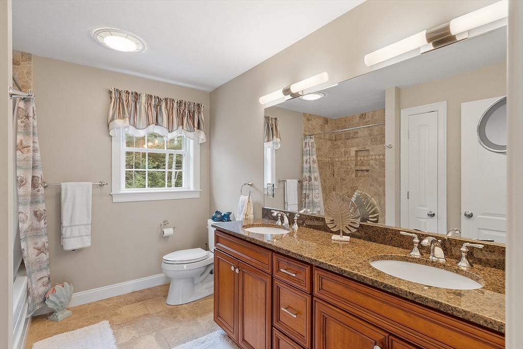 5 Azalea Lane Upton, MA 01568 - Photo 25 of 42 a bathroom with a granite countertop double vanity sink mirror and toilet
