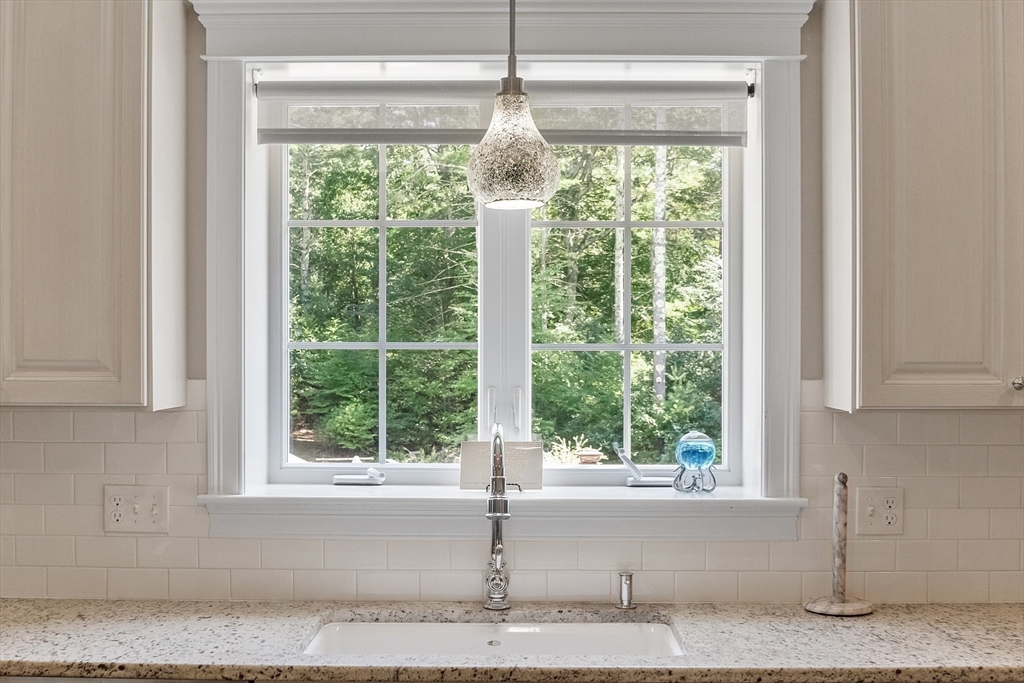 5 Azalea Lane Upton, MA 01568 - Photo 9 of 42 a kitchen with a window and cabinets