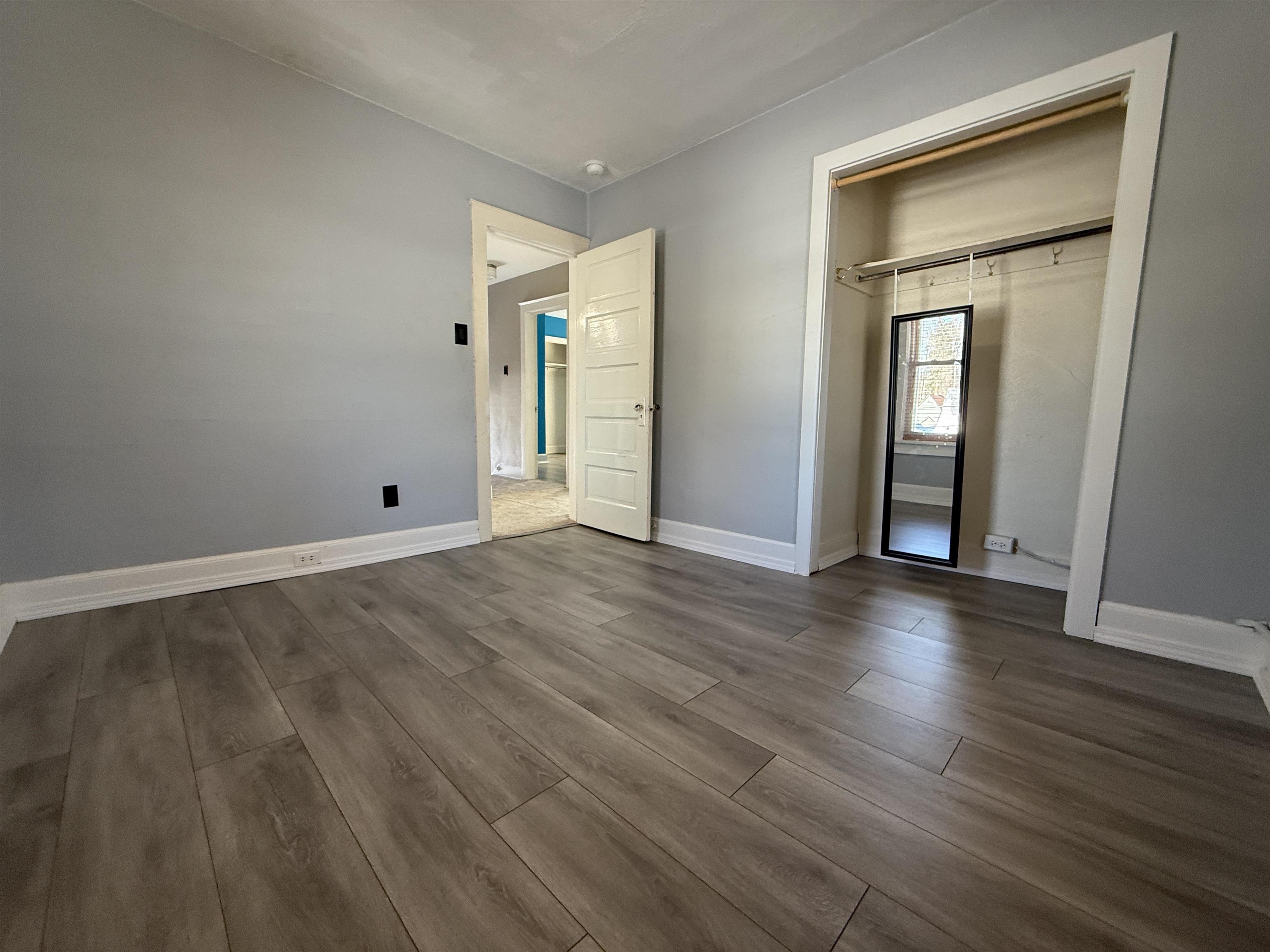 126 5th Street Northwest Chisholm, MN 55719 - Photo 22 of 35 Unfurnished bedroom with wood finished floors and a closet