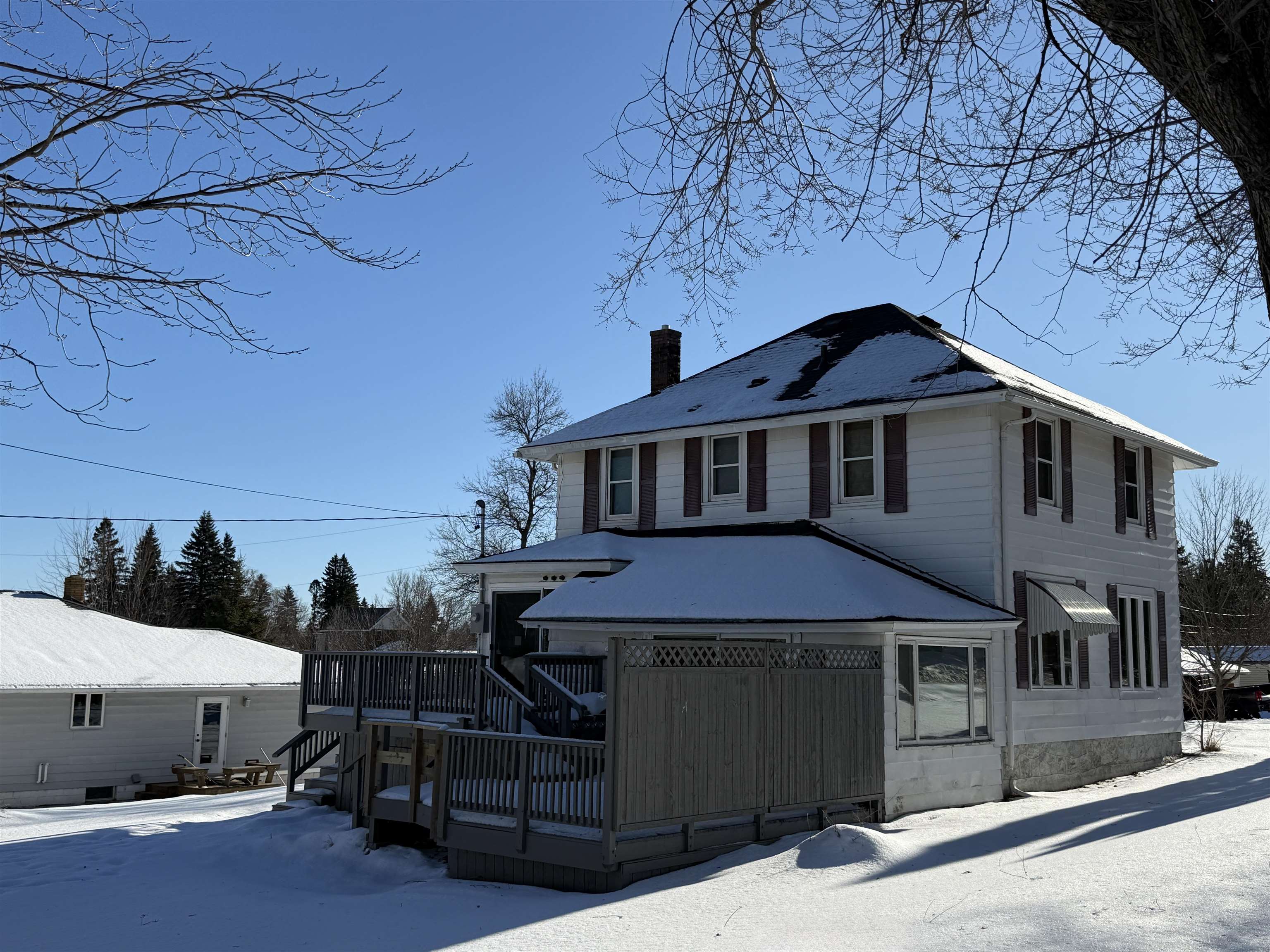126 5th Street Northwest Chisholm, MN 55719 - Photo 4 of 35 View of front of property featuring a deck and a chimney