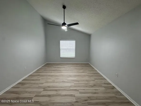 a view of empty room with windows