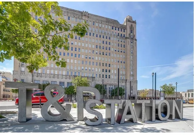 a city street lined with buildings and cars