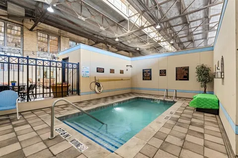 a view of a patio with table and chairs and potted plants