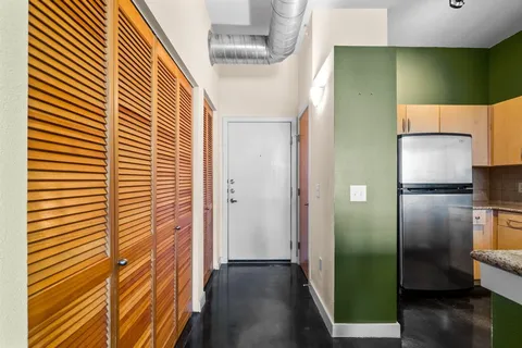 a view of a kitchen from the hallway