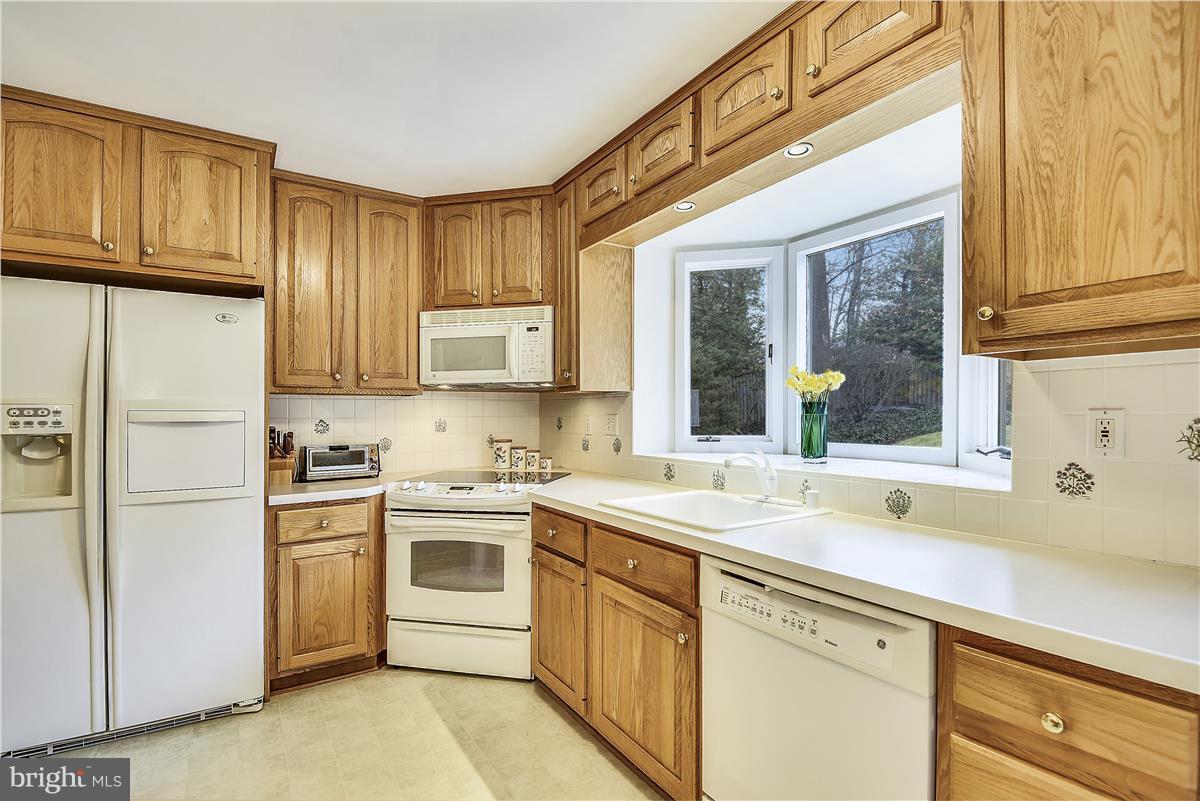 5900 Overlea Road Bethesda, MD 20816 - Photo 8 of 30 Light, bright kitchen with view of the backyard