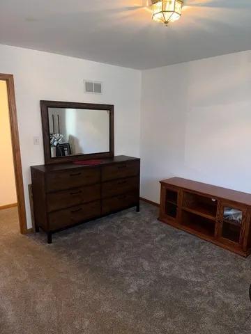 an empty room with closet area