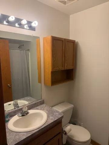 a view of house with backyard