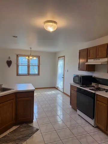 a kitchen with a stove and a sink