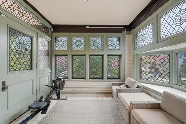 a living room with furniture and a large window