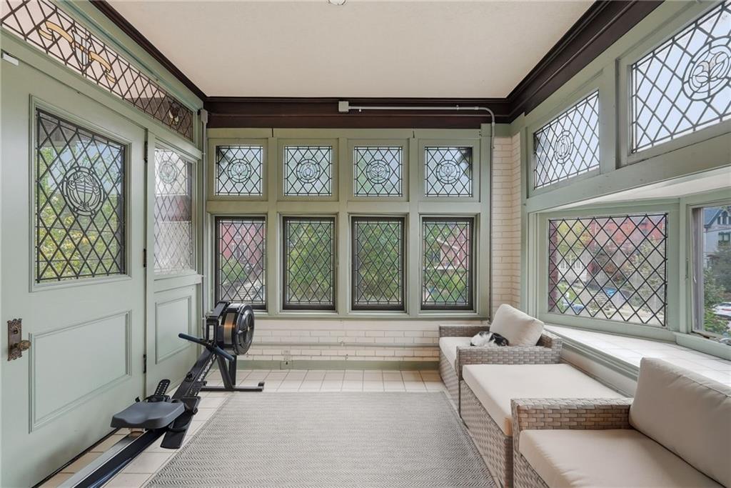 4749 Wallingford Street Pittsburgh, PA 15213 - Photo 13 of 49 a living room with furniture and a large window