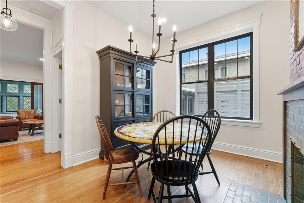 4749 Wallingford Street Pittsburgh, PA 15213 - Photo 15 of 49 a view of a dining room with furniture window and wooden floor