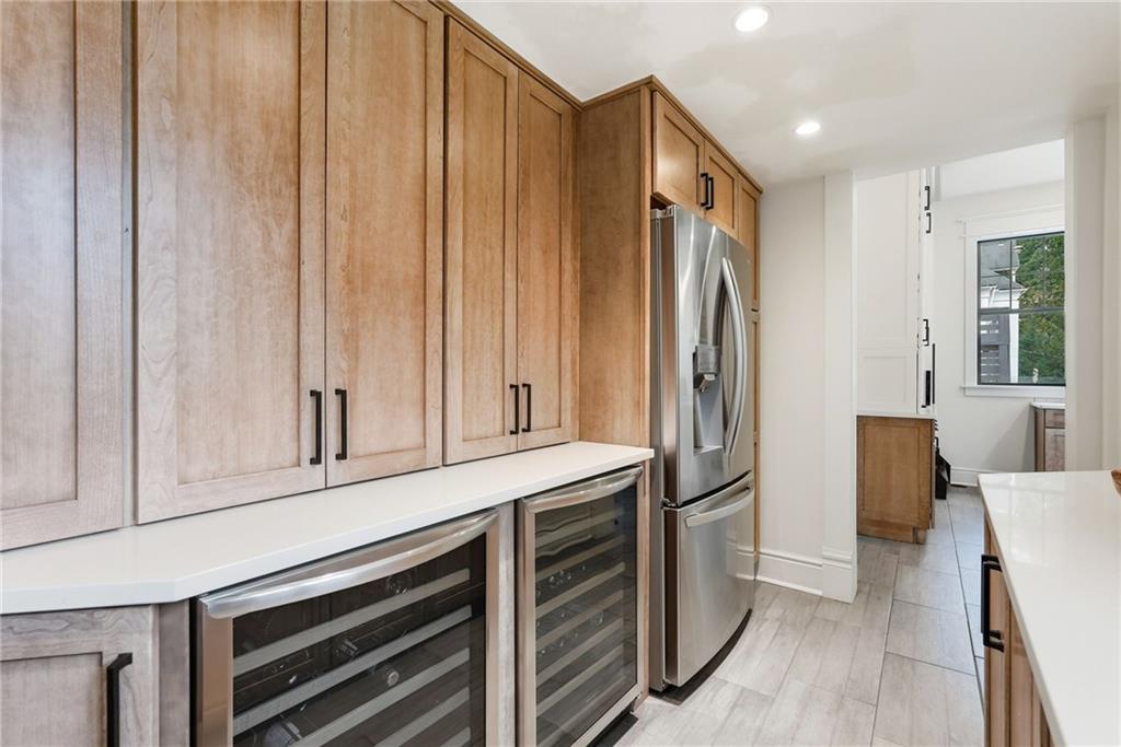 4749 Wallingford Street Pittsburgh, PA 15213 - Photo 23 of 49 a kitchen with stainless steel appliances a refrigerator and cabinets