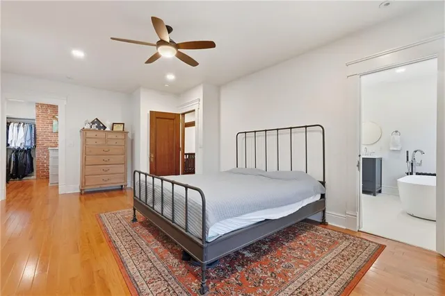 a bed room with furniture and wooden floor