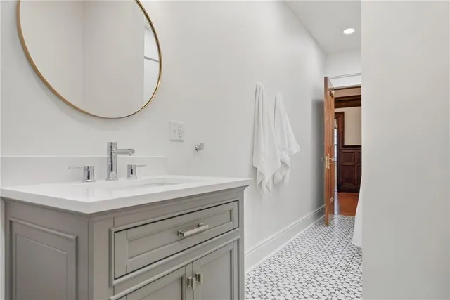 a bathroom with a sink and a mirror
