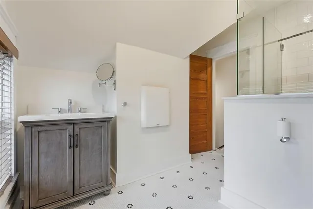 a bathroom with a sink and a mirror