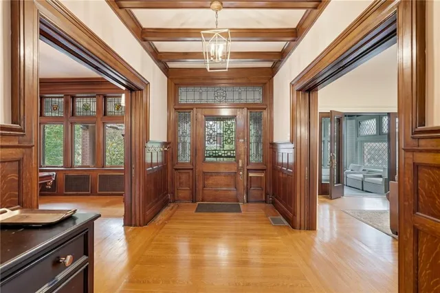 a lobby with furniture and floor to ceiling window
