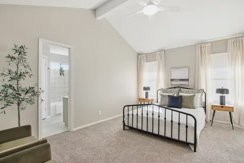 a bedroom with furniture and a fireplace