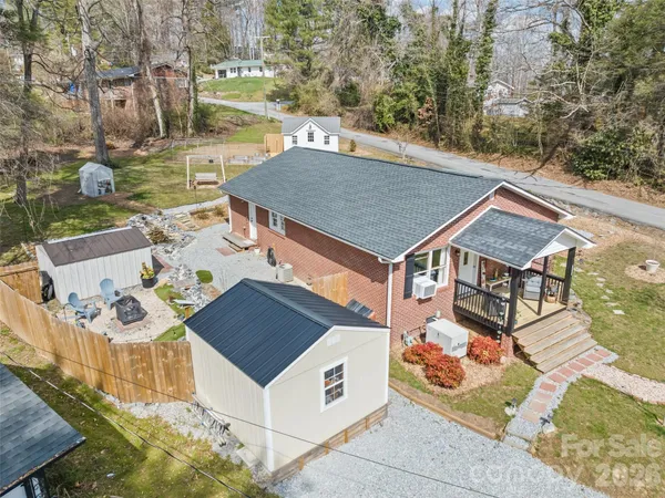 a aerial view of a house with table and chairs