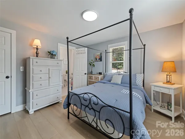 a bathroom with a sink vanity granite shower and a mirror