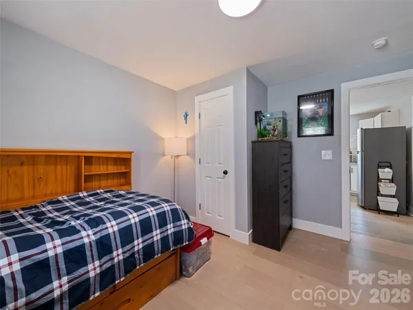 a room with a dresser and mirror