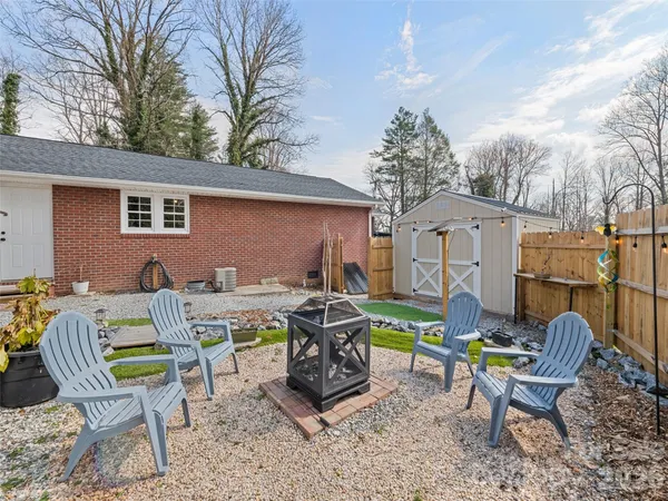 a view of a chairs and table in a patio