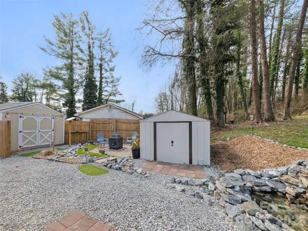 a view of a backyard with sitting area