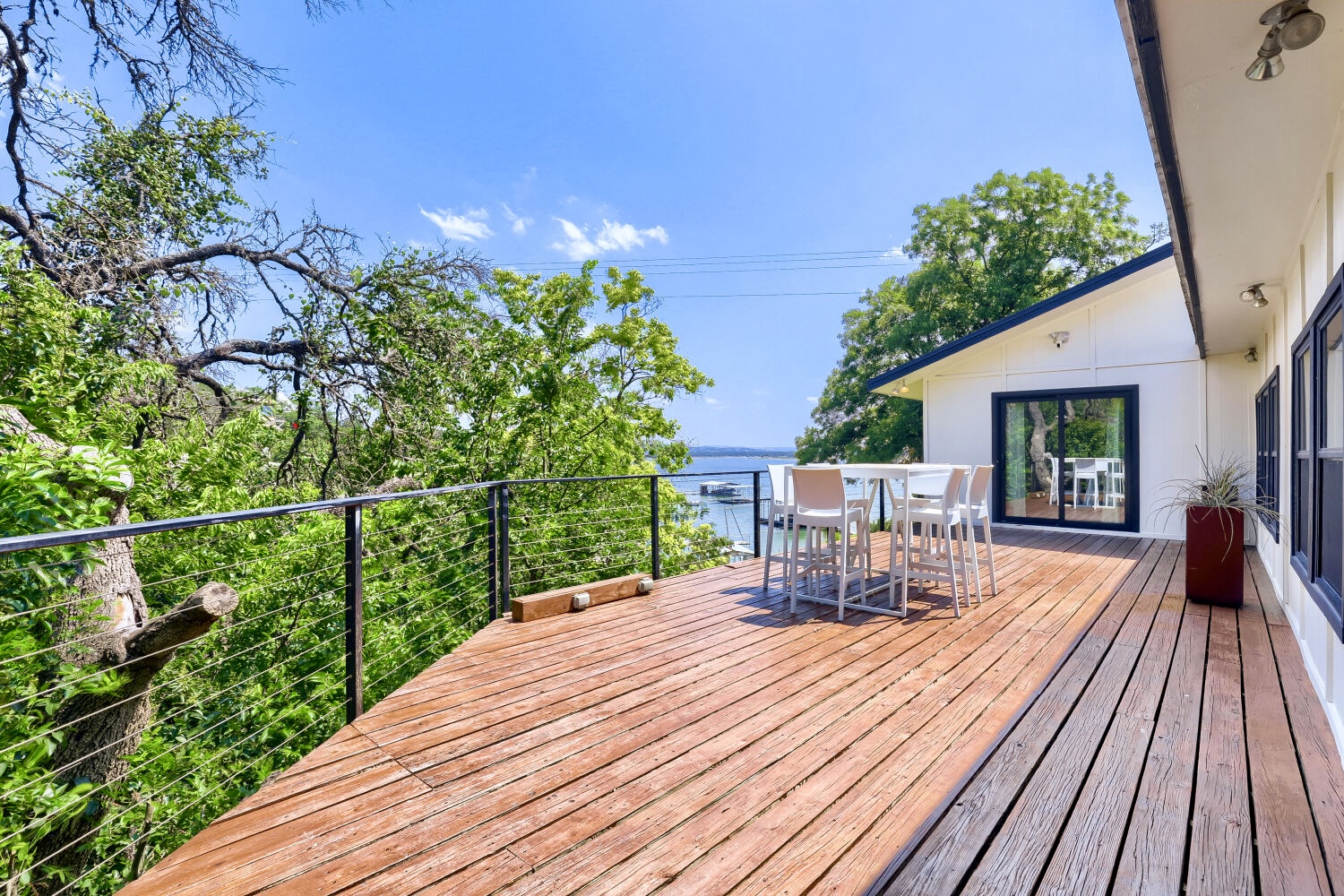 16811 South Ridge Lane Austin, TX 78734 - Photo 6 of 24 A spacious wooden deck provides ample outdoor living space with breathtaking water views.