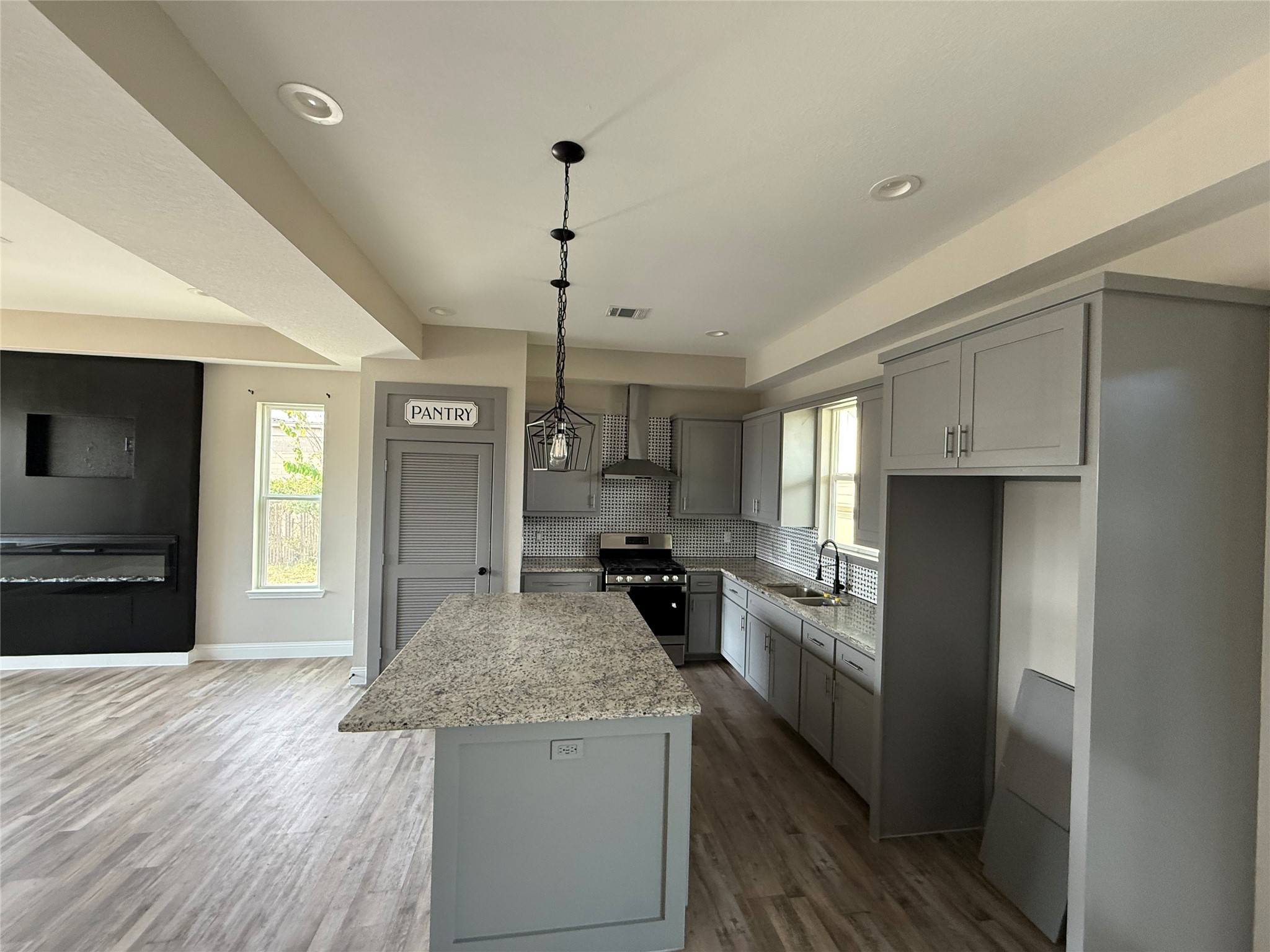 217 Kalmer Street Pasadena, TX 77502 - Photo 11 of 30 a kitchen with a stove a refrigerator and a sink