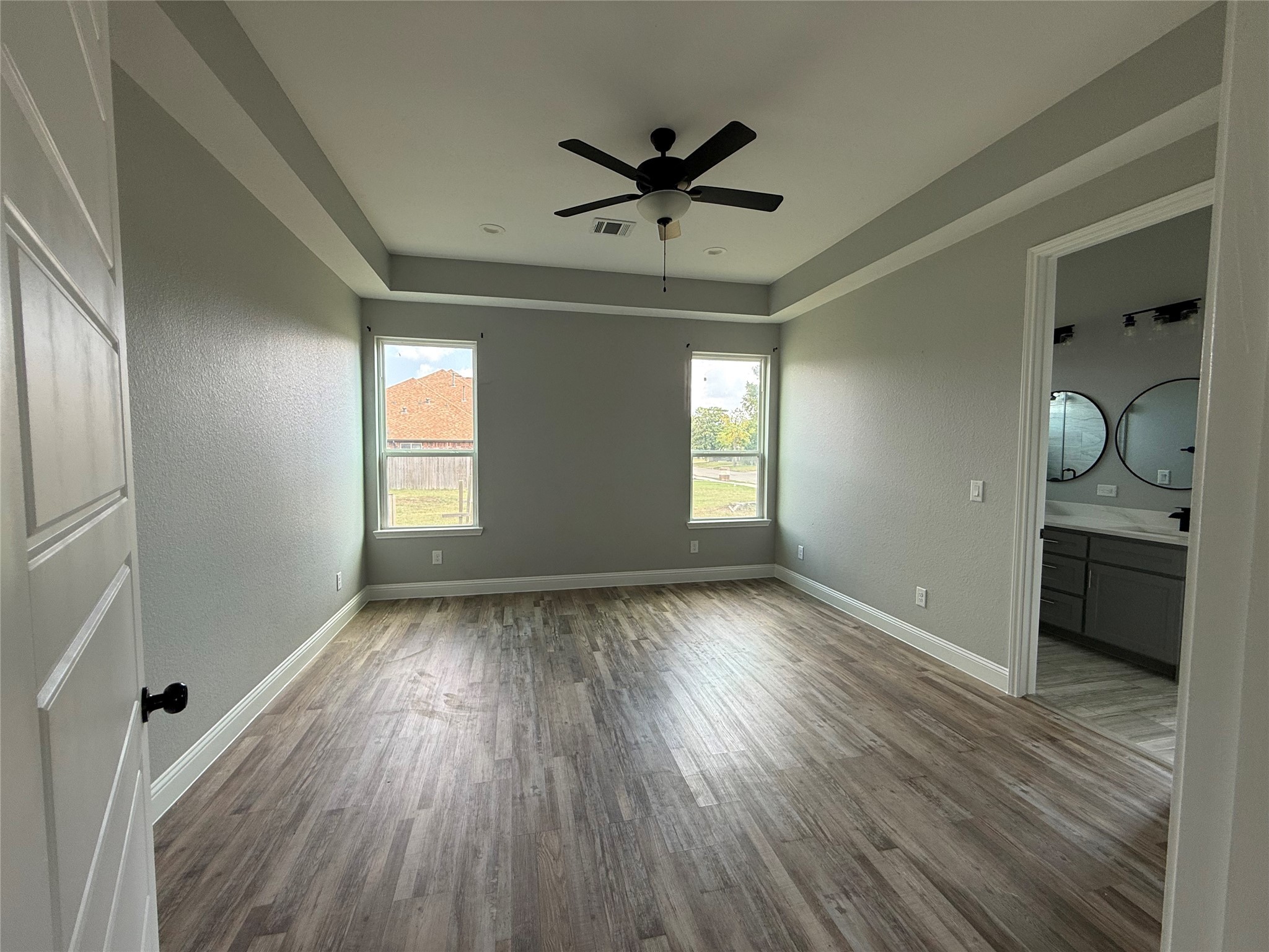 217 Kalmer Street Pasadena, TX 77502 - Photo 17 of 30 wooden floor in an empty room with a window