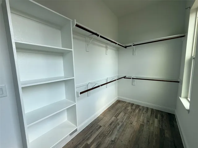 a view of an empty walk in closet