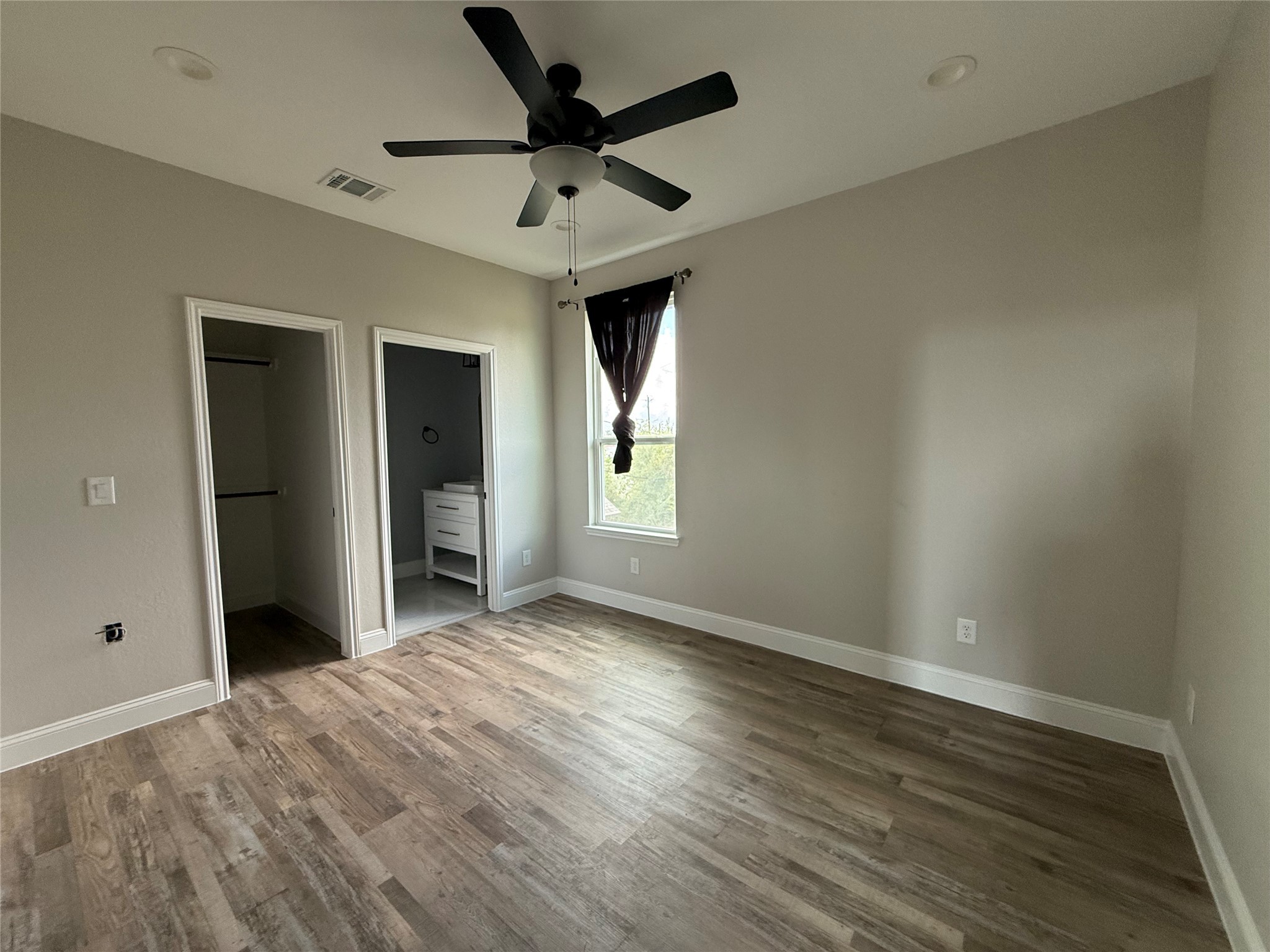 217 Kalmer Street Pasadena, TX 77502 - Photo 22 of 30 wooden floor in an empty room with a window