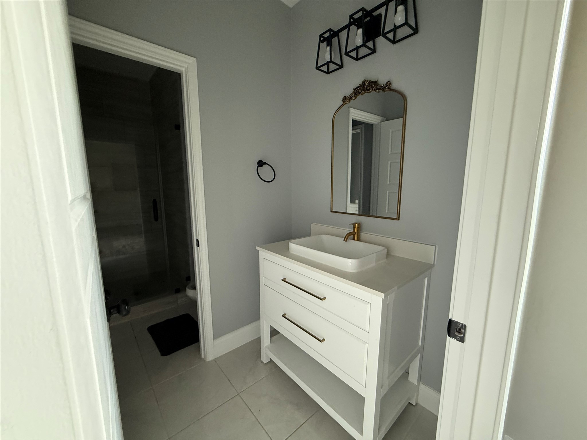 217 Kalmer Street Pasadena, TX 77502 - Photo 23 of 30 a bathroom with a sink and a mirror
