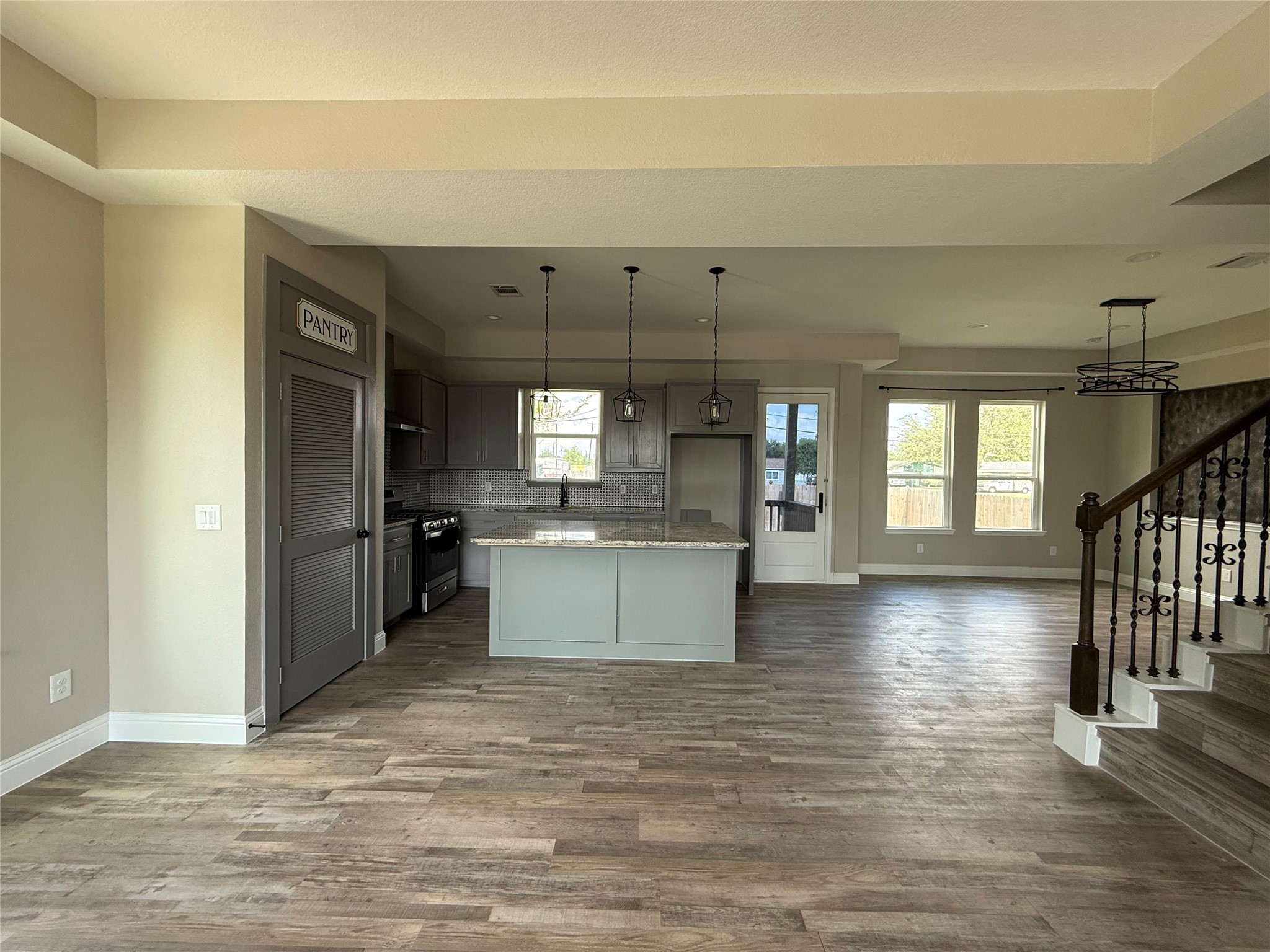 217 Kalmer Street Pasadena, TX 77502 - Photo 10 of 30 a view of a kitchen with a sink and a refrigerator