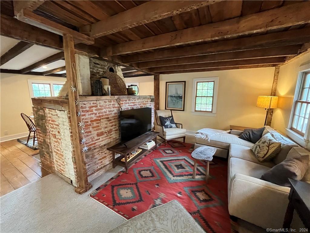 15 Riverview Road New Milford, CT 06755 - Photo 12 of 40 a living room with furniture and a flat screen tv