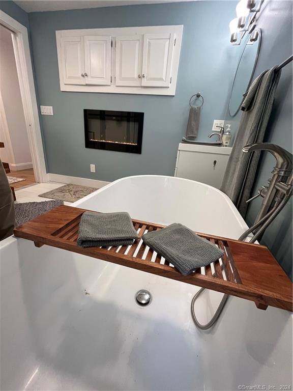 15 Riverview Road New Milford, CT 06755 - Photo 27 of 40 a living room with furniture and a fireplace